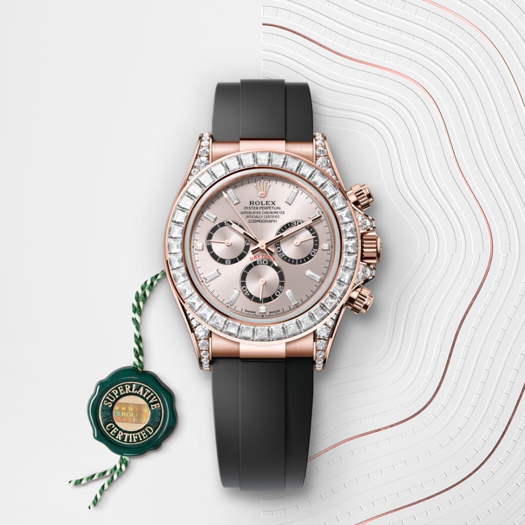 A Rolex watch with a black strap and diamond bezel, next to a green Superlative Certified tag.