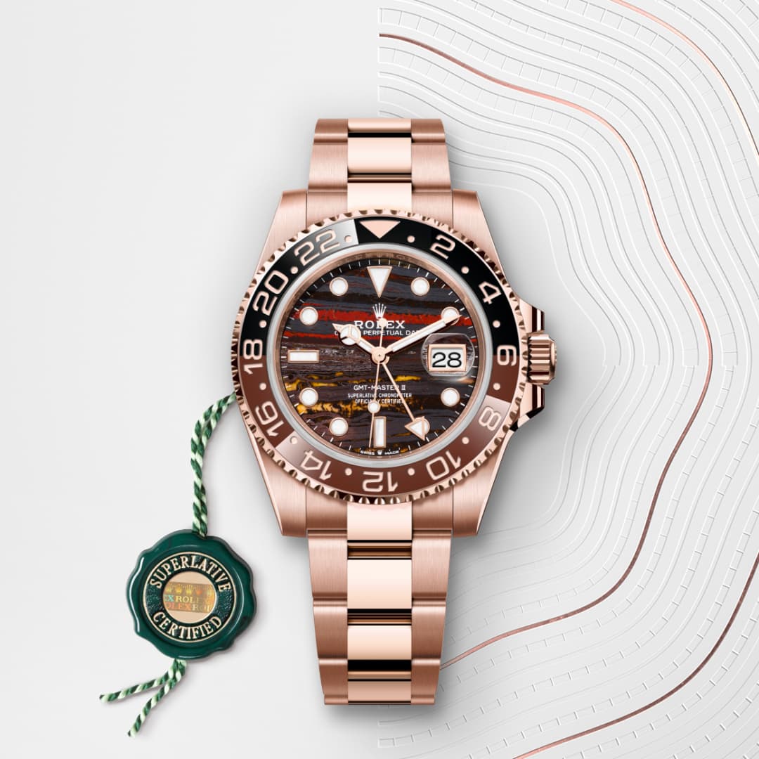 A rose gold Rolex watch with a patterned dial and date display, shown with a green Superlative Certified tag.