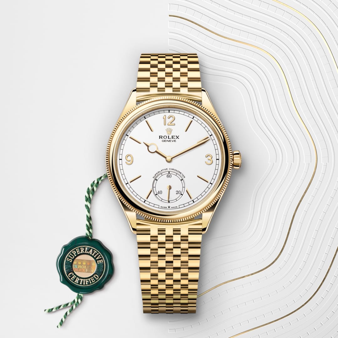 Gold Rolex watch with a white dial and woven bracelet, next to a green superlative certified seal.