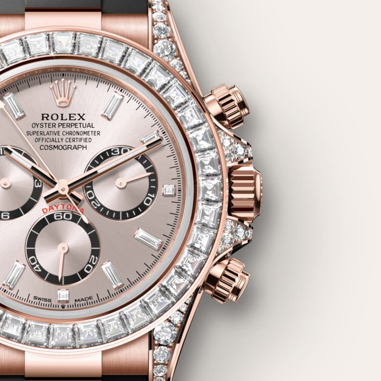 Close-up of a luxury Rolex Daytona rose gold watch with diamond bezel and three black subdials.