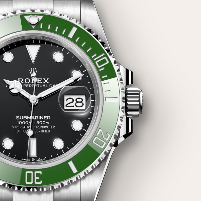 Close-up of a Rolex Submariner watch with a green bezel, black dial, and date display at 3 o’clock.