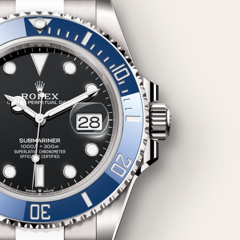 Close-up of a Rolex Submariner watch with a blue bezel, black dial, and date display.