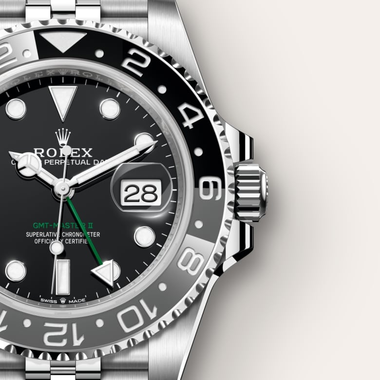Close-up of a Rolex GMT-Master II watch showing the time, date, and black and silver bezel.