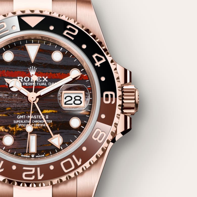 Close-up of a Rolex GMT-Master II watch with a textured, multicolored dial and rose gold accents.