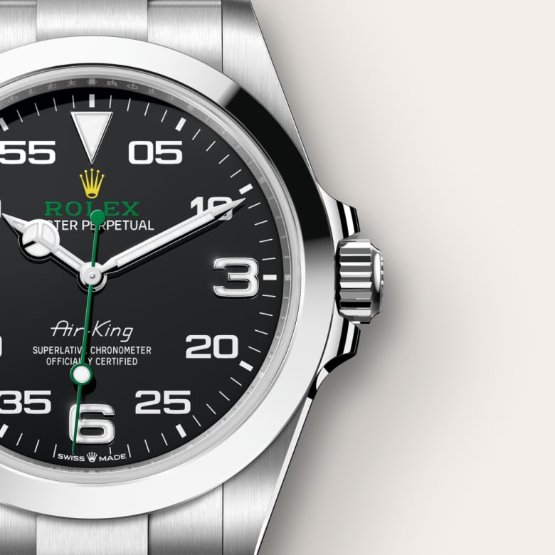 Close-up of a Rolex Air-King watch with a black dial and stainless steel case and bracelet.