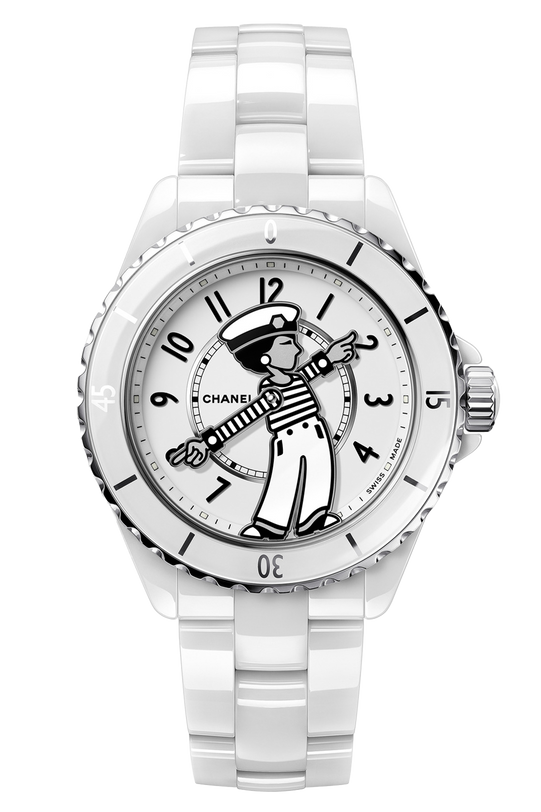 The Chanel Mademoiselle J12 La Pausa is a limited edition white ceramic watch featuring a cartoon sailor on the dial, whose arms serve as hour and minute hands. It has a matching white bezel and bracelet with sleek silver accents.