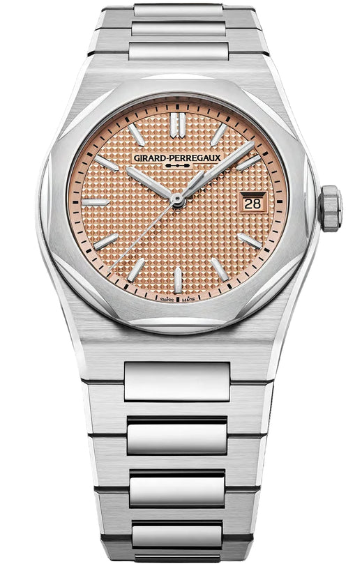 Silver watch with a pink face on a white background