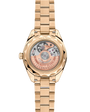 OMEGA Seamaster Aqua Terra 150M 30mm, Moonshine™ gold on Moonshine™ gold Watch with a transparent caseback on a Moonshine™ gold integrated bracelet.