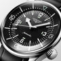 Close-up of the Longines Legend Diver automatic wristwatch featuring a black dial and luminous markers.