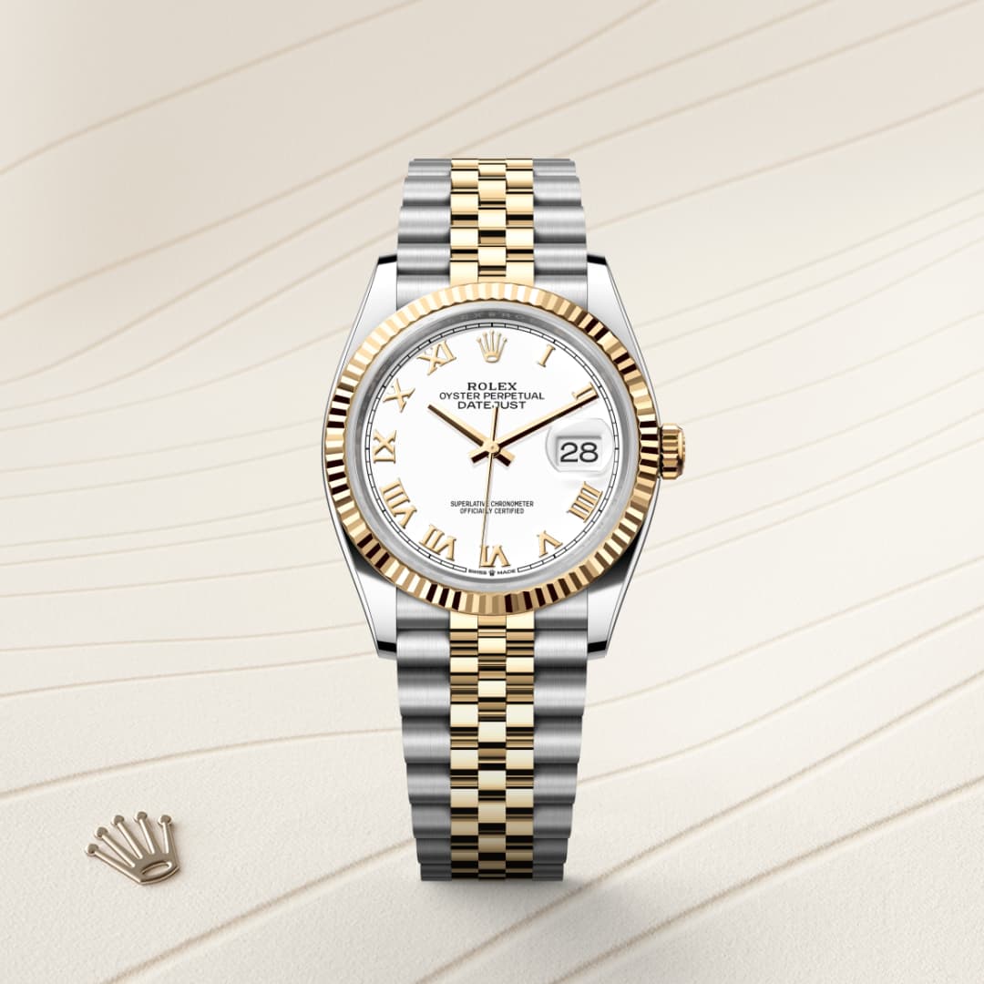 A two-tone Rolex watch with a white face and gold Roman numerals on a cream textured background.