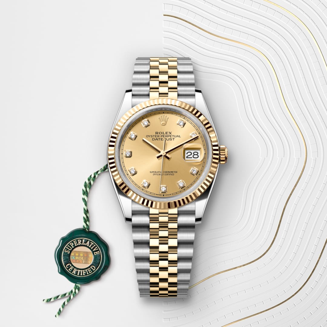 A gold and silver Rolex Datejust watch with a diamond dial and Superlative Certified tag on a white background.