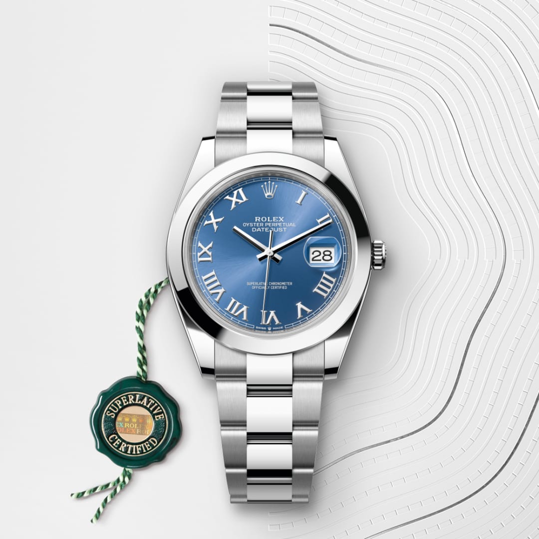 A Rolex Datejust watch with a blue dial and Roman numerals, next to a green Superlative Certified seal.
