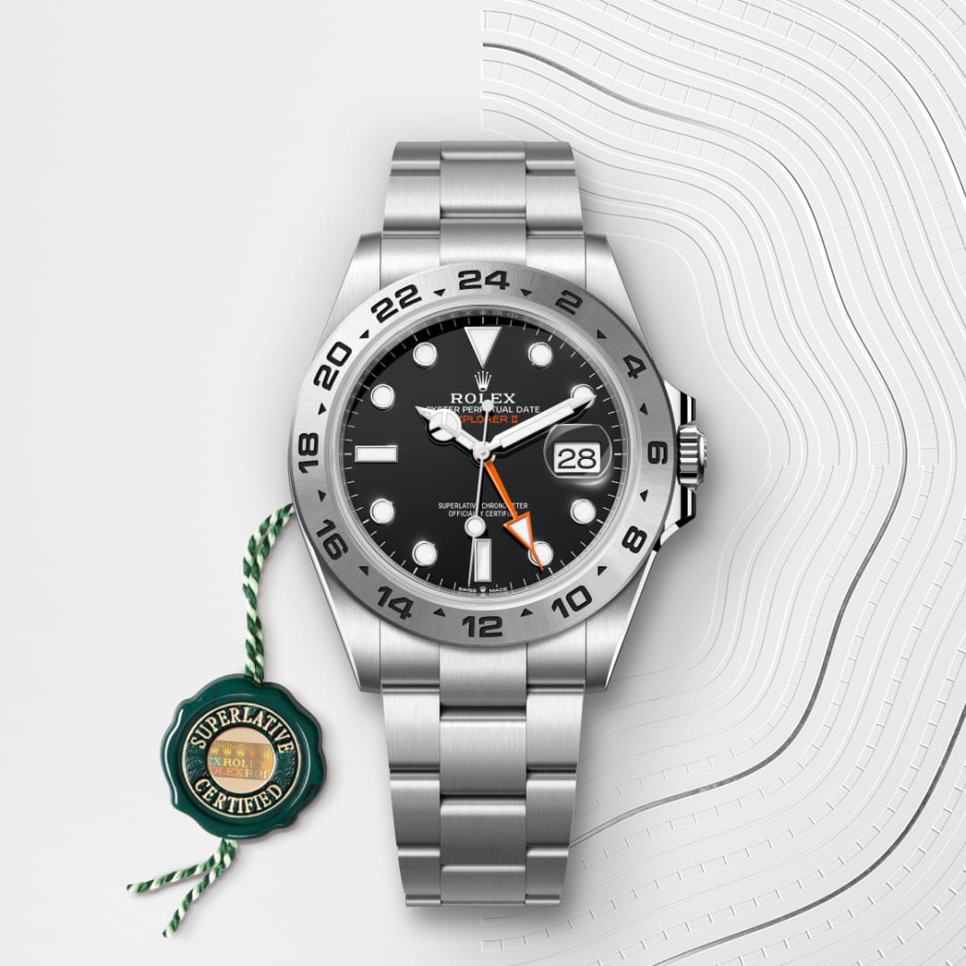 Rolex stainless steel watch with black dial, date display, and certification tag on a white patterned background.