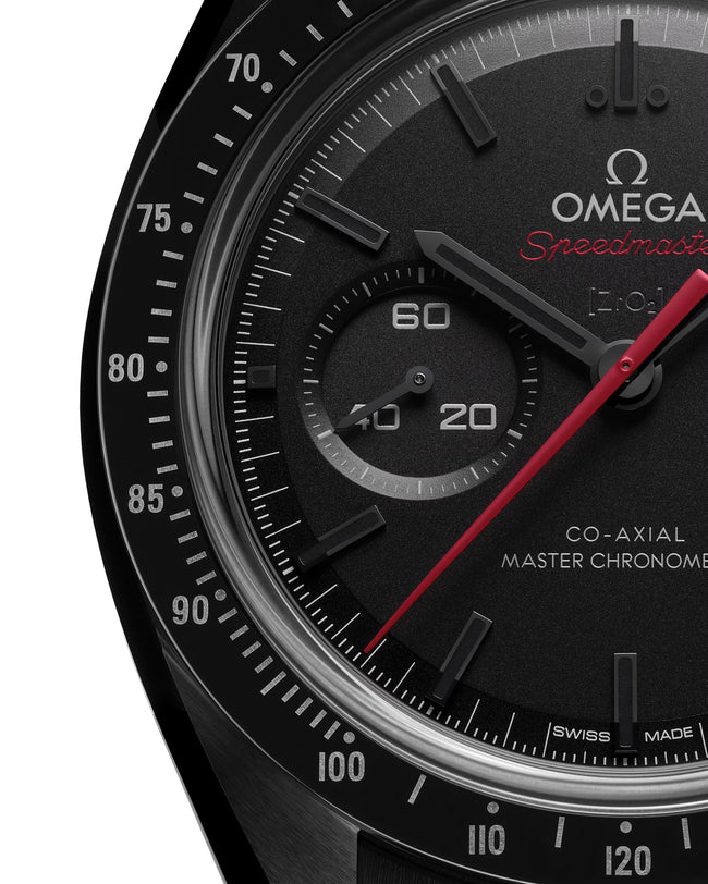 Close up of OMEGA Dark Side of The Moon with red dial and black face of watch