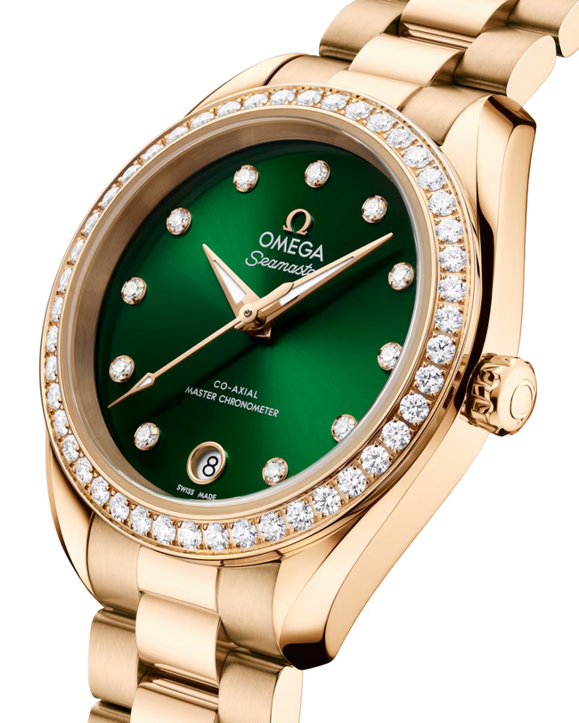 OMEGA Seamaster Aqua Terra 150M 30mm, Moonshine™ gold on Moonshine™ gold Watch, with a Diamond Bezel and Green Dial with Diamond Markers on a Moonshine™ gold integrated bracelet.
