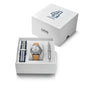 Oris watch set with silver dial and tan leather strap, navy striped fabric strap, and pen in white presentation box.