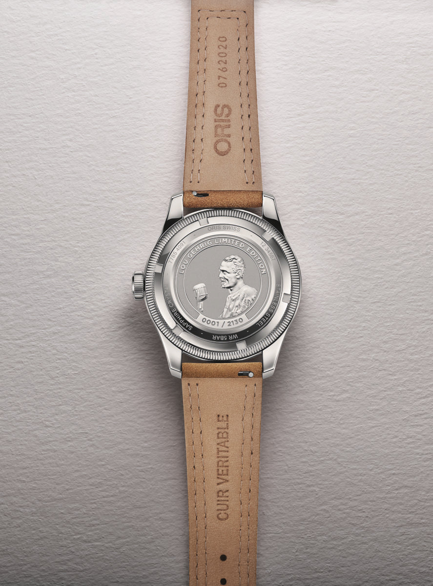 Silver-tone watch with tan leather strap featuring engraved caseback portrait and "Lou Gehrig Limited Edition" text.