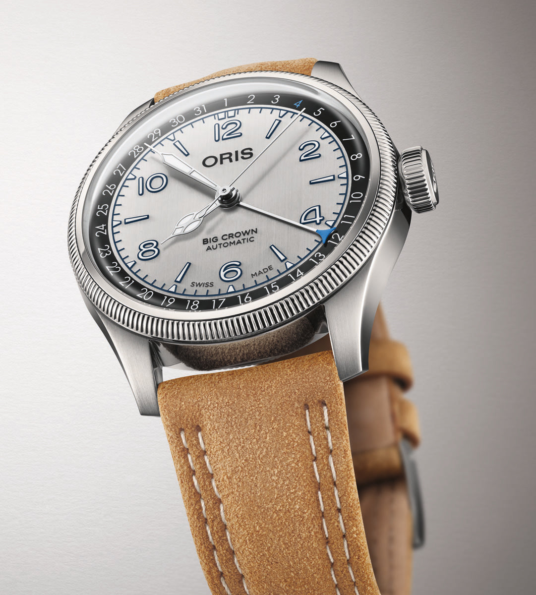 Oris Big Crown Automatic watch with silver dial, Arabic numerals, rotating bezel, and tan leather strap.