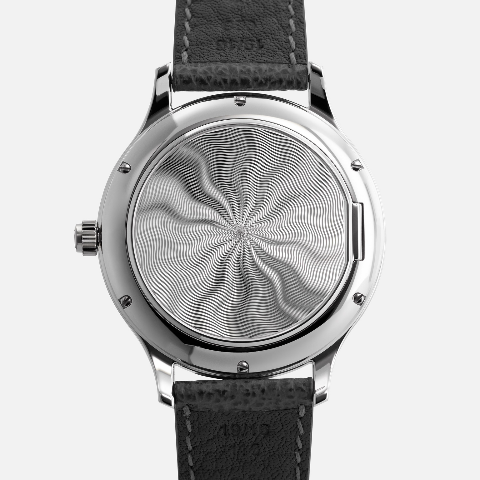 The Chopard L.U.C XPS 1860 Officer Limited Edition for Hodinkee features an intricate swirling pattern on the back and comes with a black leather strap.