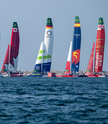 Four sail boats in water during SailGP competition