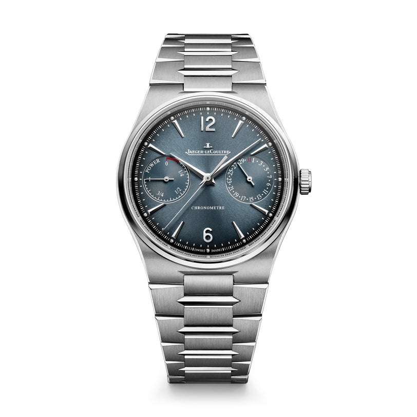 Stainless steel watch with blue dial, date window, power reserve indicator, and three subdials on metal bracelet.