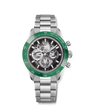Stainless steel chronograph watch with green bezel, black skeleton dial, and three subdials on metal bracelet.