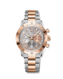 Two-tone chronograph watch with rose gold bezel, silver dial, and alternating silver and rose gold bracelet links.