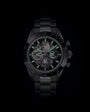Black stainless steel chronograph watch with skeleton dial, green luminous hands and hour markers, and tachymeter bezel.