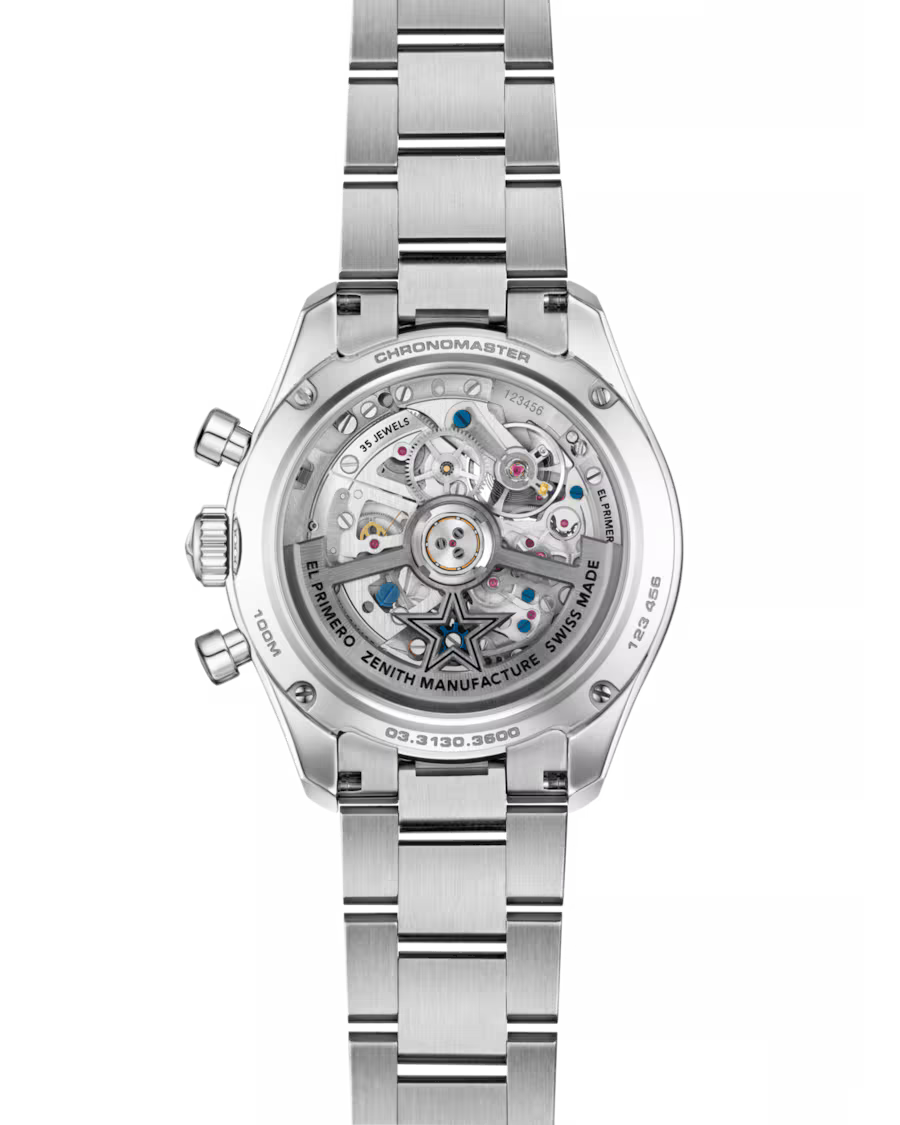 Silver stainless steel chronograph watch with visible skeleton dial movement, three subdials, and matching metal bracelet.