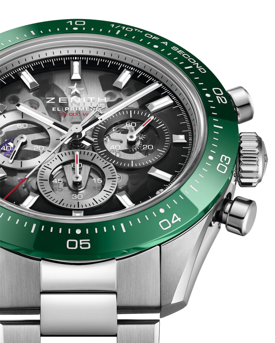 Zenith chronograph watch with green tachymeter bezel, black dial, silver hands, and stainless steel bracelet.