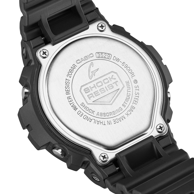 Black resin digital watch with silver-tone metal case back and shock-resistant design.