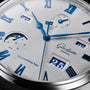 Close-up of the Glashütte Original Senator Excellence Perpetual Calendar watch face, featuring blue Roman numerals, moon phase, and date windows.