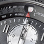 Close-up of the Hamilton Khaki Aviation X-Wind Auto Chrono, featuring an aviation-inspired dial with white pointer near 2 and airspeed gauge just above 0, reminiscent of cockpit flight instruments.