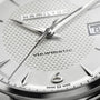 Close-up of the Hamilton Jazzmaster Viewmatic Auto watch face with silver hands, textured dial, date display, Swiss Made text, and the number 6—highlighting modern design and fine craftsmanship.