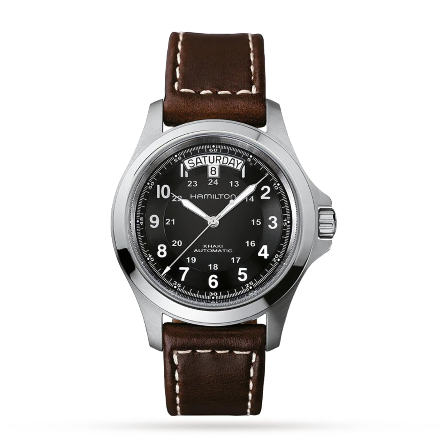 The Hamilton Khaki Field King Auto features a brown leather strap, black dial with white numerals and military time markings, crown protectors, and a day-date display at 12 o’clock.