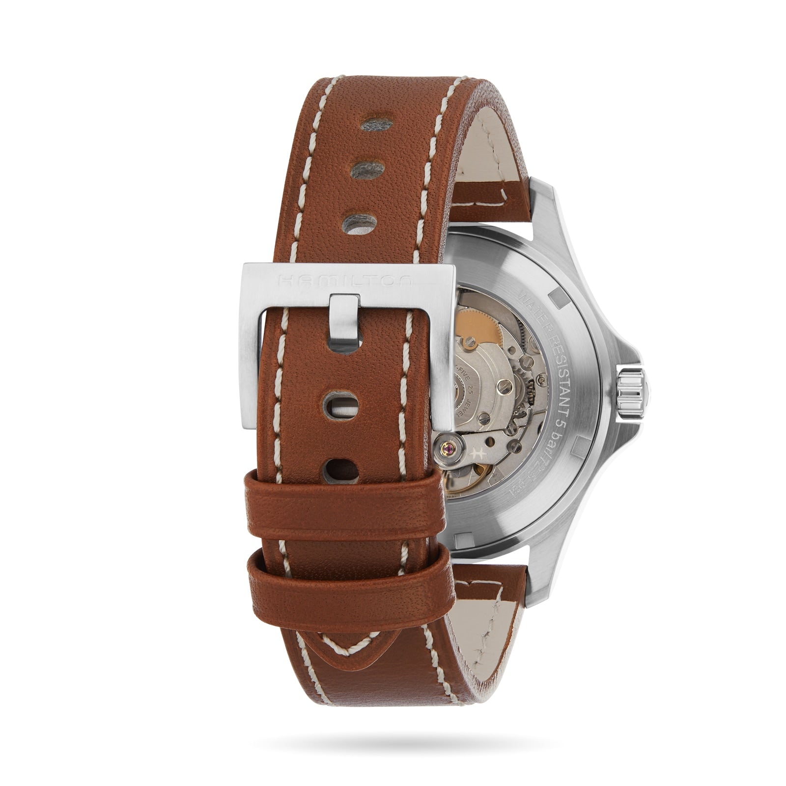 A close-up of the Hamilton Khaki Field King Auto wristwatch with a brown leather strap highlights its stainless steel buckle, crown protectors, and transparent case back displaying the mechanical movement inside.