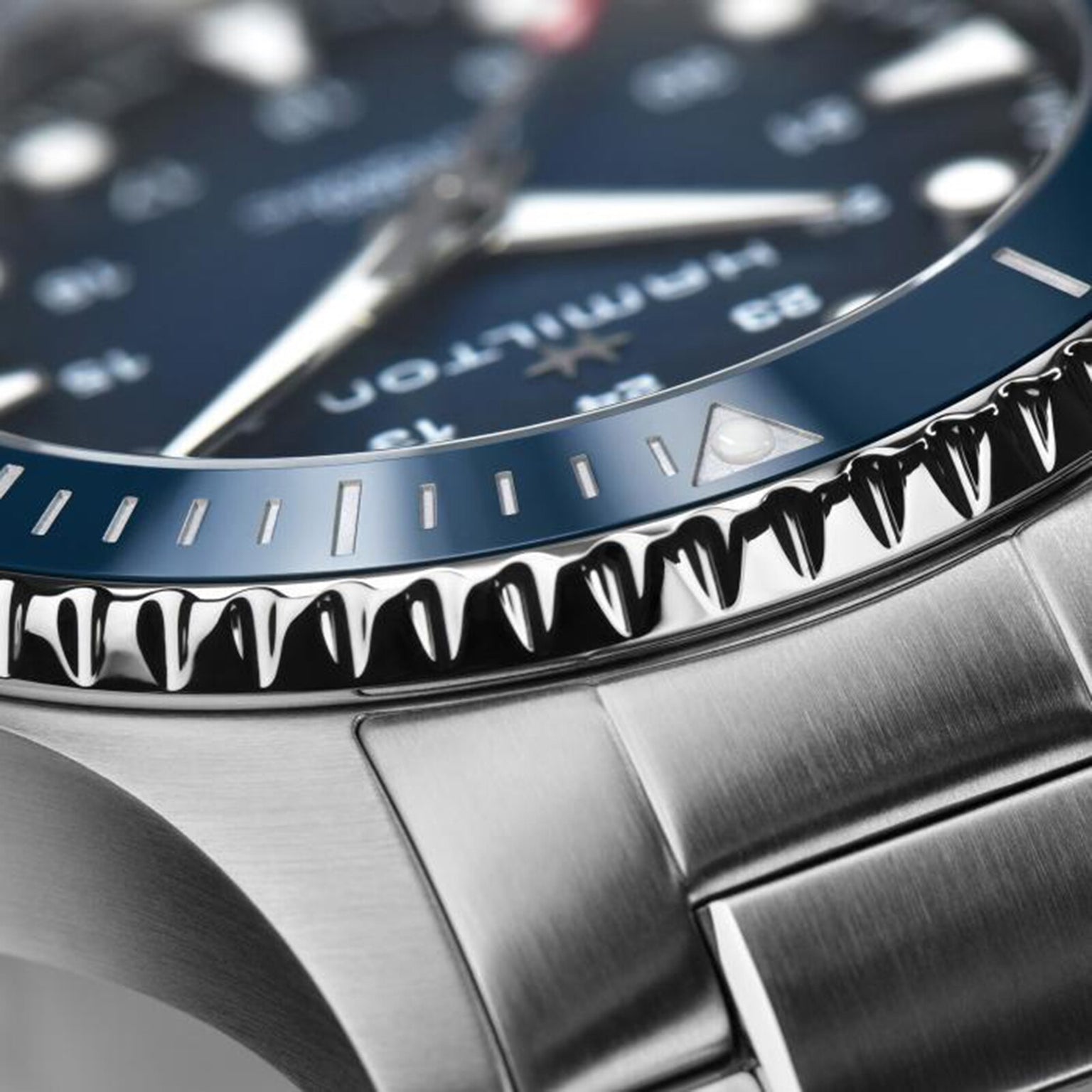 Close-up of the Hamilton Khaki Navy Scuba Auto, showcasing its stainless steel bezel, minute-marked dial, and metal bracelet—an aquatic-inspired timepiece.
