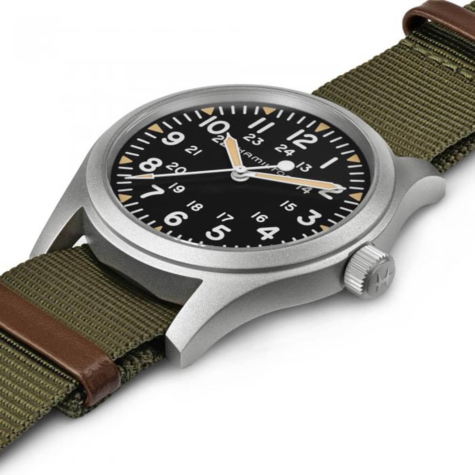 The Hamilton Khaki Field Mechanical 42mm features a black dial, white Arabic numerals, and a green fabric strap with brown leather accents—a robust soldiers watch.