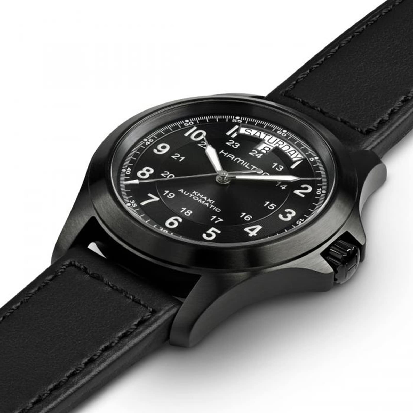 The Hamilton Khaki Field King Auto is a black wristwatch with a black leather strap, white Arabic numerals, and day-date display, embodying the brand’s military-inspired field watch heritage.