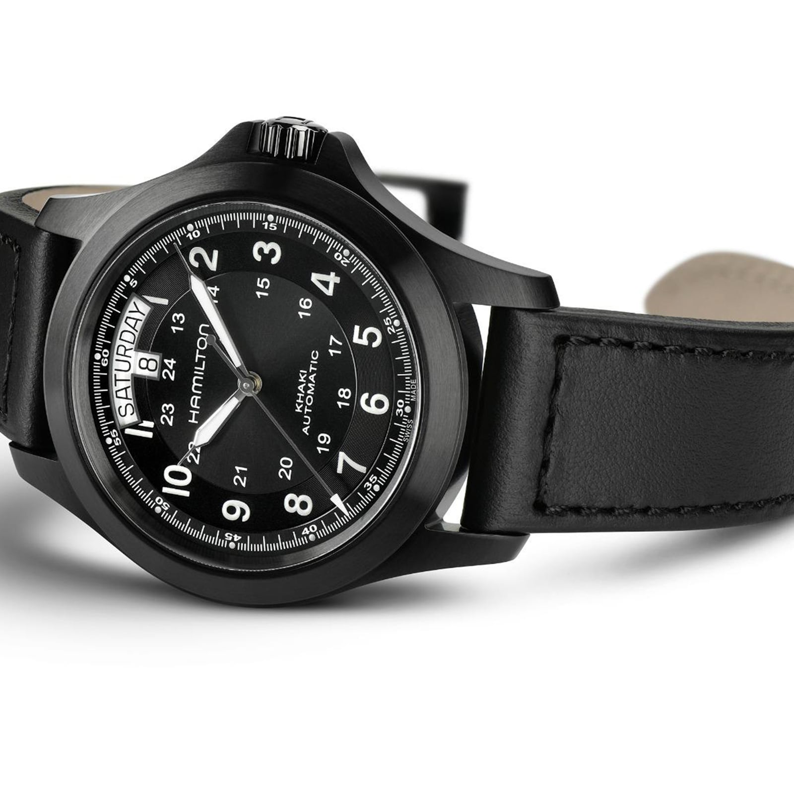 The Hamilton Khaki Field King Auto features a black dial with white numerals, day-date display, and a black leather strap—a classic field watch that honors Hamilton’s military heritage.