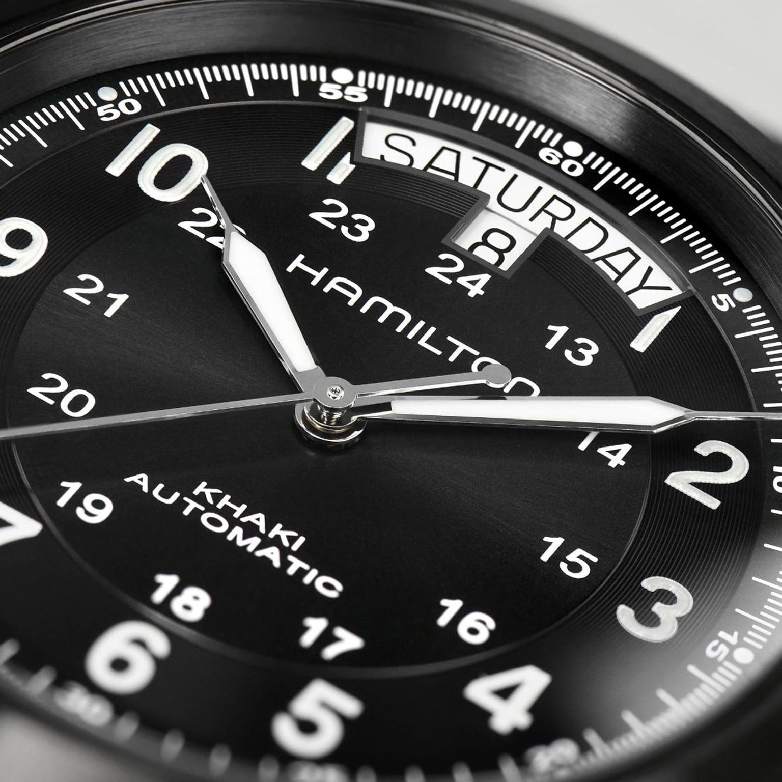 Close-up of the Hamilton Khaki Field King Auto, highlighting its military-inspired design with the time at 10:09:42, day set to Saturday, and date at 8—a classic field watch from Hamilton.