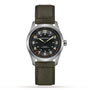 A Hamilton Khaki Field Titanium Auto watch with a green dial, white numerals, silver case, and green leather strap is displayed against a white background.