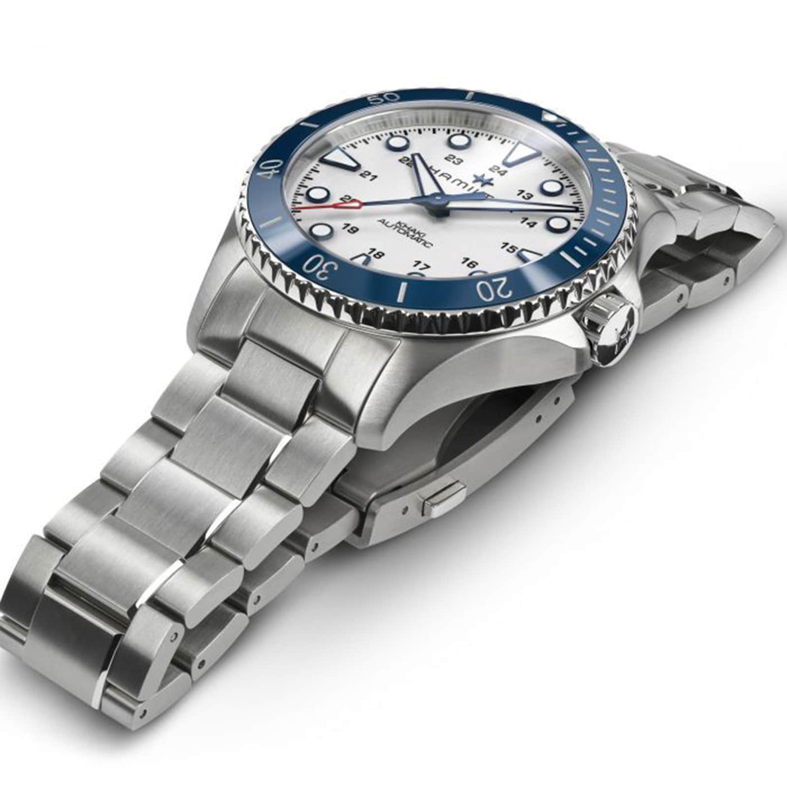 The Hamilton Khaki Navy Scuba Auto, featuring a stainless steel case, blue ceramic bezel, white dial, and metal bracelet, is shown angled on a white background—ideal for summer adventures by the sea.