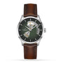 The Hamilton Jazzmaster Open Heart Auto is a contemporary wristwatch with a brown leather strap, smoked green dial, silver case, and visible mechanical movement inspired by the Jazzmaster Open Heart collection.