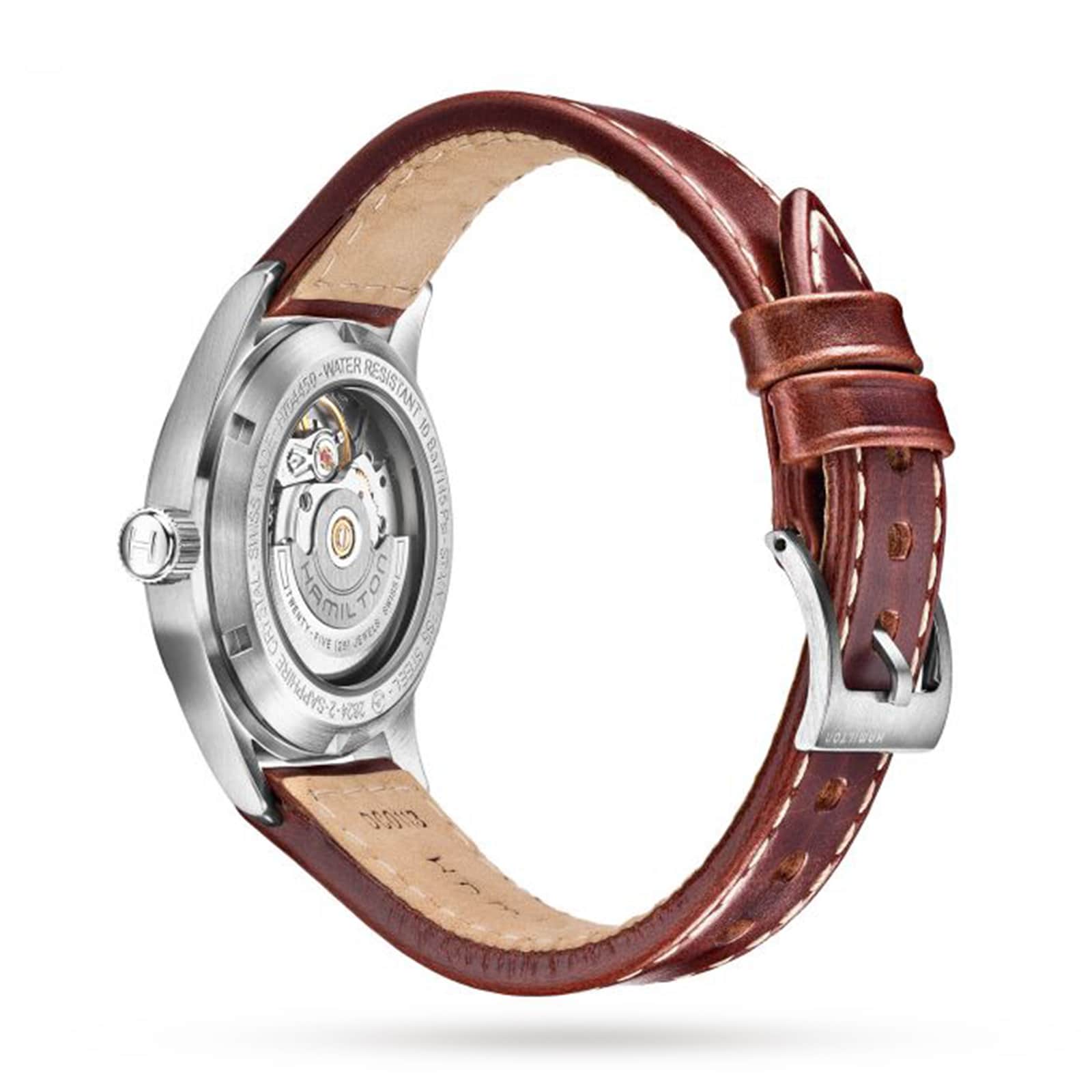 The Hamilton King Auto is a military-inspired watch with a brown leather strap and visible mechanical movement on its stainless steel case back, shown against a white background.
