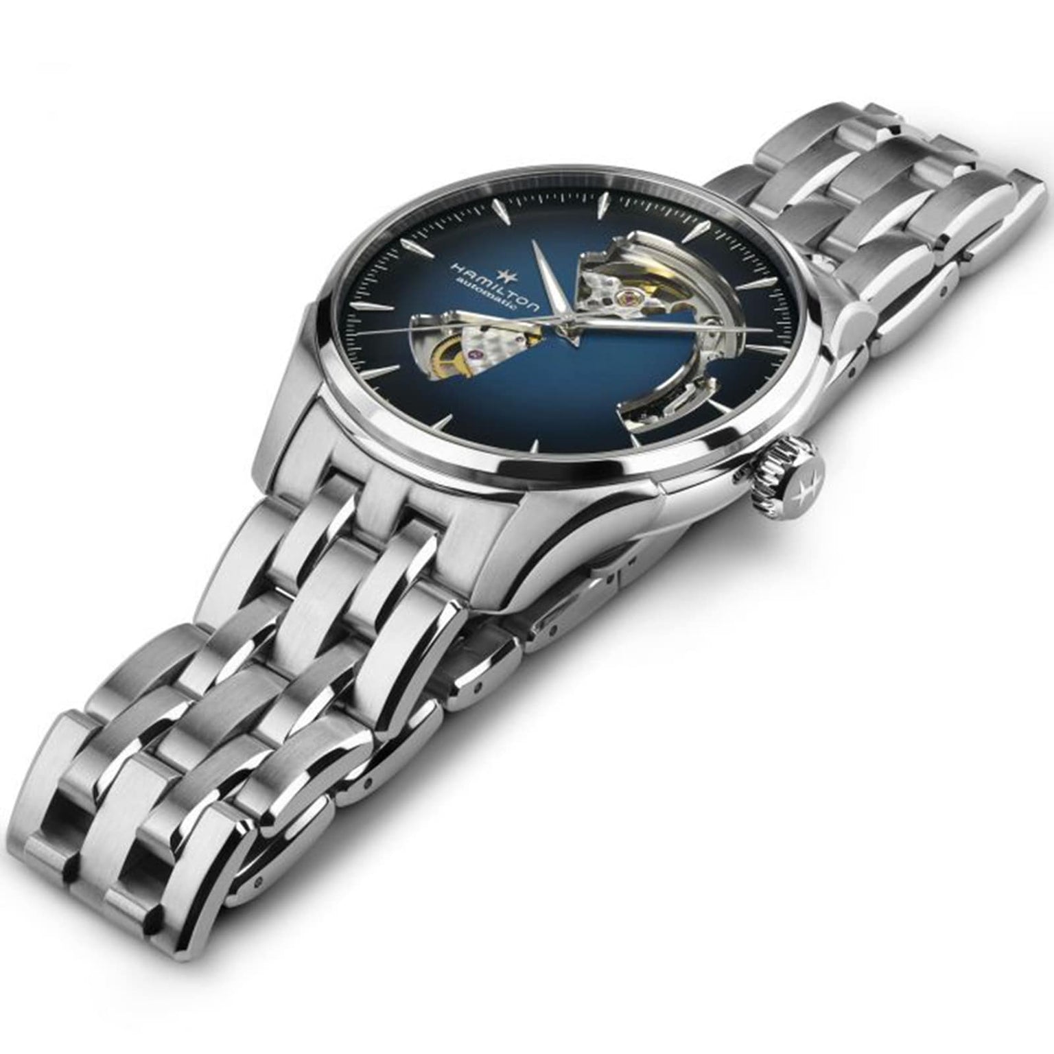 The Hamilton Jazzmaster Open Heart Auto, a silver stainless steel wristwatch with a blue smoked dial revealing part of its mechanism, is shown at an angle against a white background.