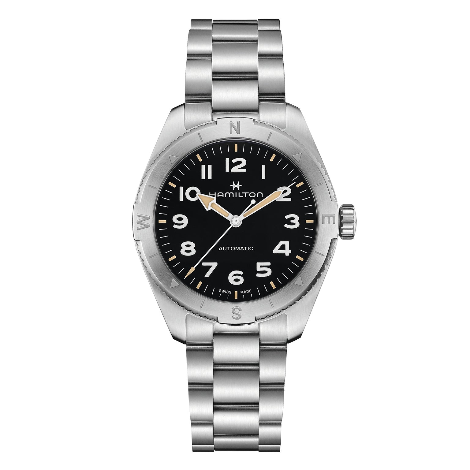The Hamilton Khaki Field Expedition Auto is a stainless steel automatic watch featuring a black dial, silver Super-LumiNova hands, Arabic numerals, and a metal link bracelet.