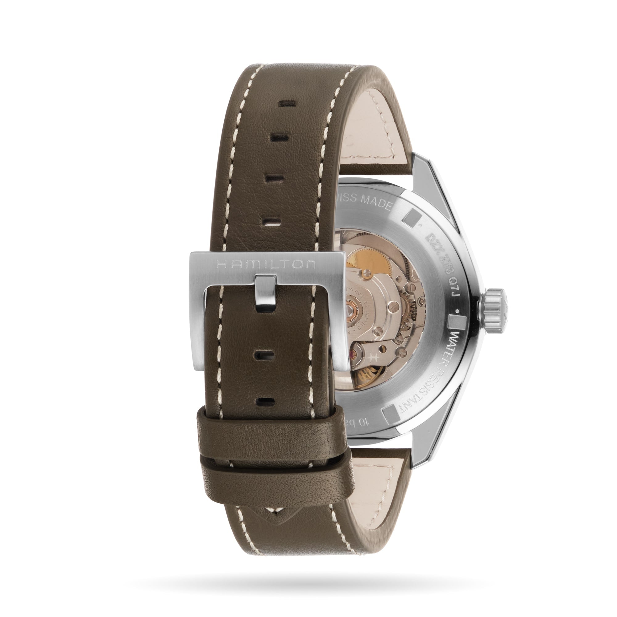 Close-up of the Hamilton Khaki Field Expedition Autos back, showing its mechanical movement through the stainless steel case and olive green leather strap with a silver buckle.