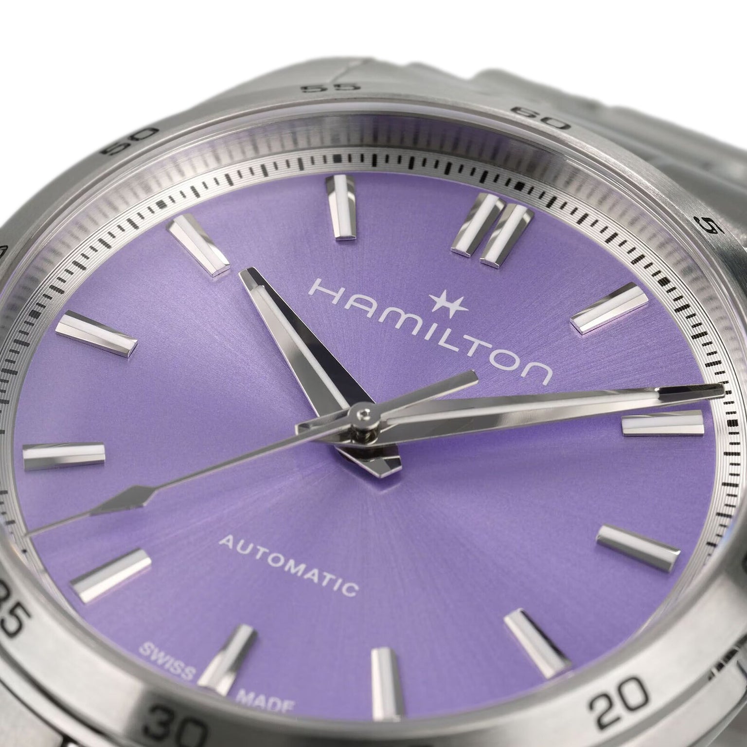 Close-up of the Hamilton Jazzmaster Performer Auto watch featuring a purple dial, stainless steel markers and hands, with Automatic displayed above 6 o’clock.