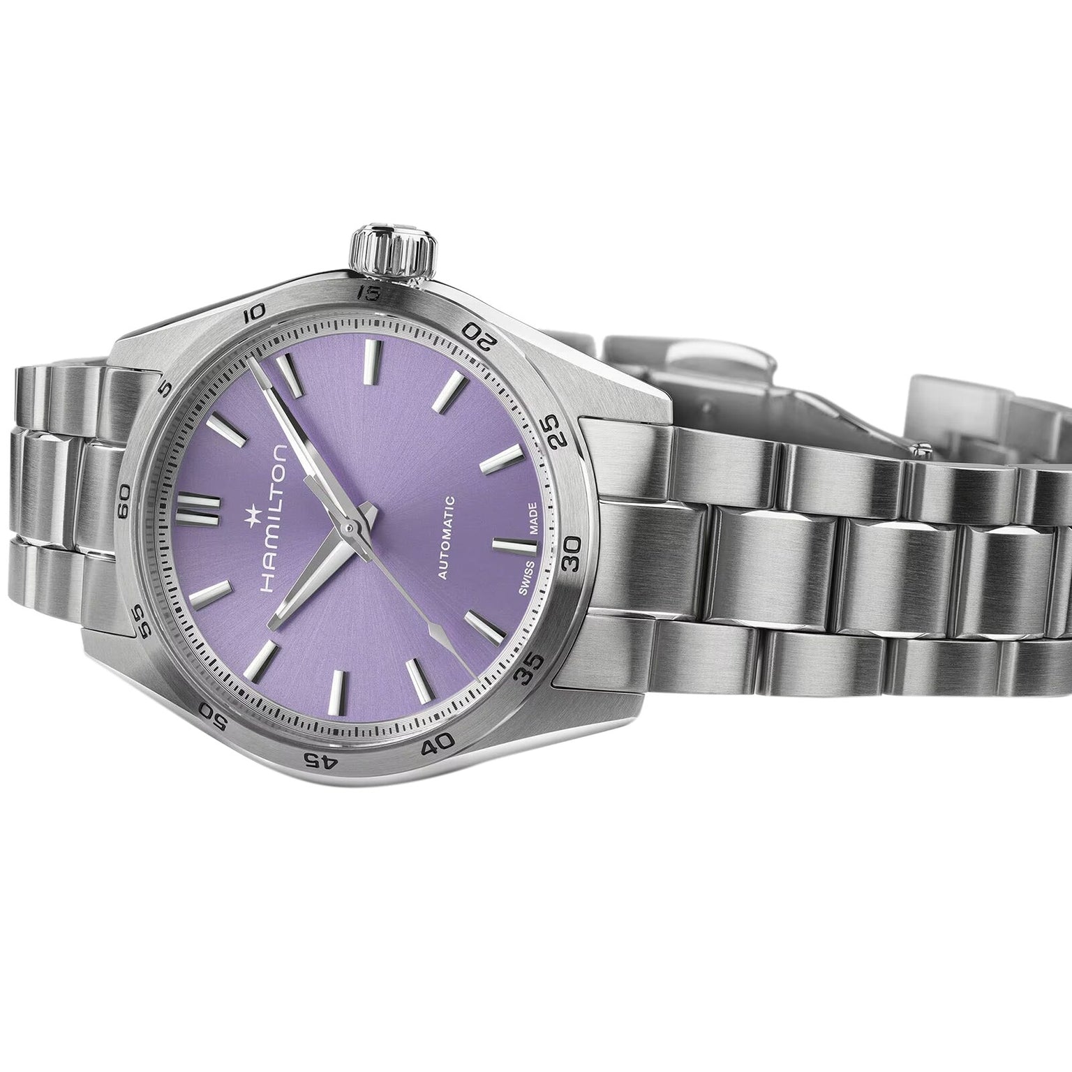 The Hamilton Jazzmaster Performer Auto features a lilac dial with silver hour markers, an automatic movement, and a stainless steel link bracelet, all elegantly designed under the renowned Hamilton brand.
